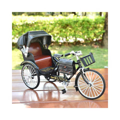 A retro style rickshaw model ornament with a vintage alloy finish made of 28 inch alloy